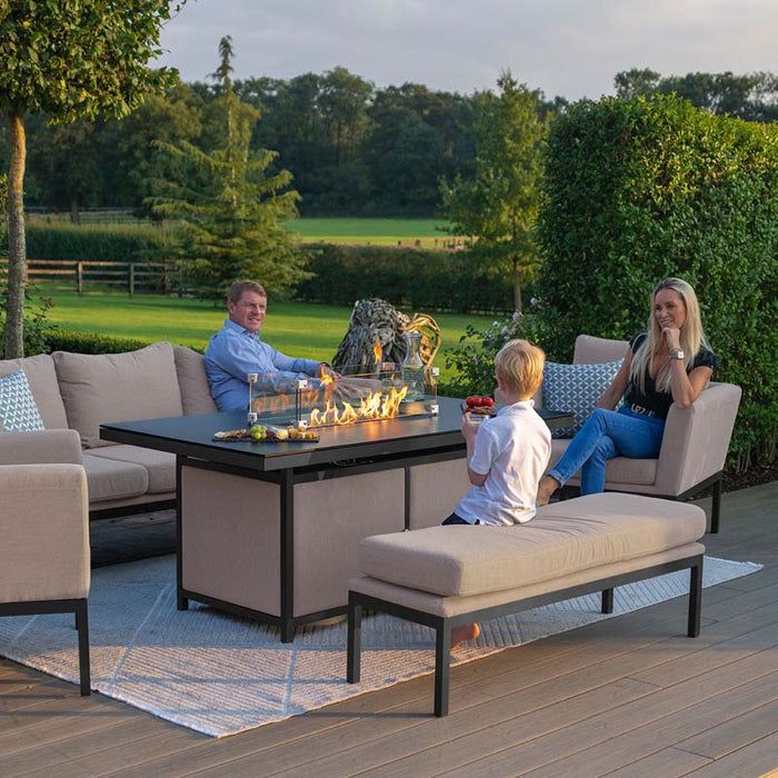 A stylish lifestyle shot of the Pulse 3 Seater Sofa Set with fire pit, offering a sophisticated outdoor setting for dining and relaxation.