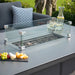 Safe and sleek glass barrier protecting the fire while adding style to the table.