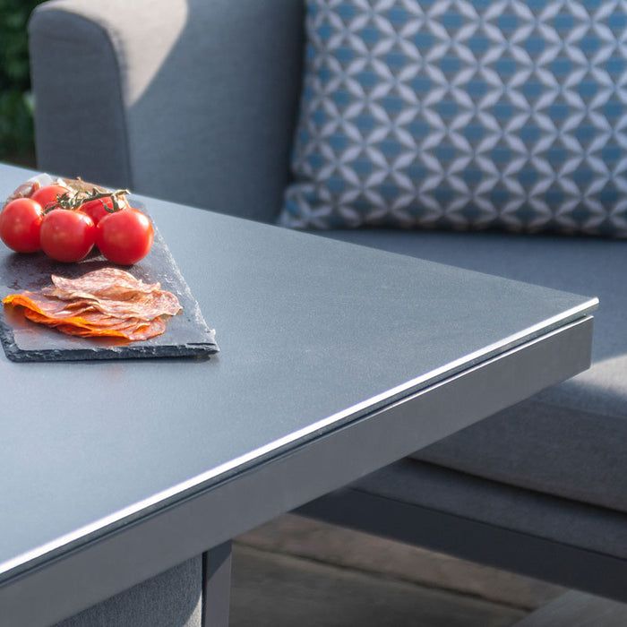 Close-up of tomatoes and cured meats on the Pulse Fire Pit table in flanelle grey.