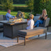 Family enjoying an outdoor evening by the Pulse 3 Seater Sofa Dining Set with Fire Pit.