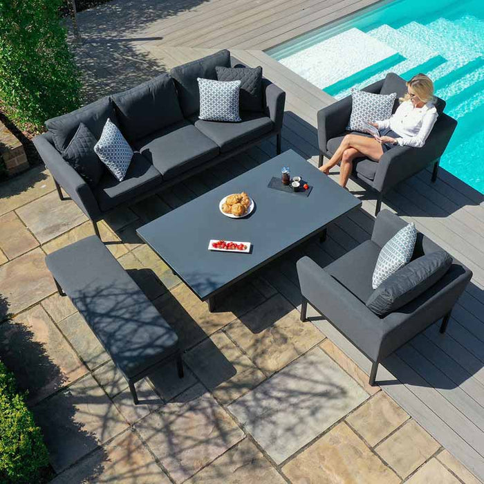 Overhead angle of the Maze Pulse 3 Seater Sofa Dining Set with Rising Table in Charcoal, perfectly set by a poolside for outdoor dining and relaxation.