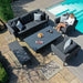 Overhead angle of the Maze Pulse 3 Seater Sofa Dining Set with Rising Table in Charcoal, perfectly set by a poolside for outdoor dining and relaxation.