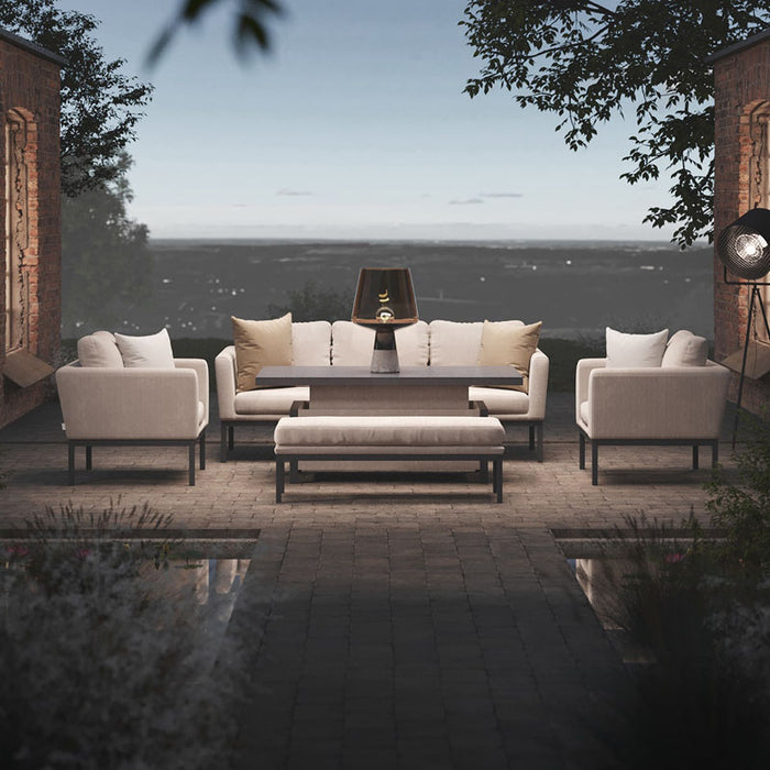 The Maze Pulse 3 Seater Sofa Dining Set in Oatmeal displayed outdoors, with a rectangular rising table and comfortable seating, perfect for outdoor lounging and dining.