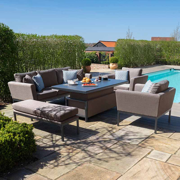 The Maze Pulse 3 Seater Sofa Dining Set in Taupe shown in full, with armchairs, a bench, and a central rising table, displayed in a clear outdoor setting.