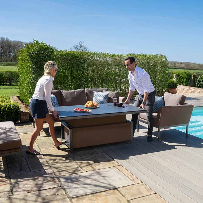 Close-up image showing the Maze Pulse 3 Seater Sofa Dining Set in Taupe with the rising table in its raised position, demonstrating the table’s adjustable feature.