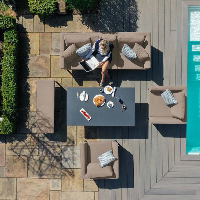 A top birdseye view of the Maze Pulse 3 Seater Sofa Dining Set in Taupe, featuring the spacious seating and the rising table, perfect for outdoor dining and lounging.