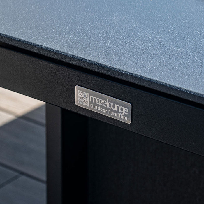 Close-up of the Maze Lounge brand logo on the sleek edge of the Rising Table from the Pulse Left Handed Rectangular Corner Dining Set, symbolising quality and style.