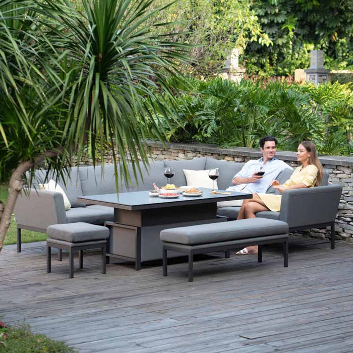 Casual yet elegant outdoor setting with a couple seated on the Pulse Left-Handed Rectangular Corner Dining Set, enjoying a serene garden environment.