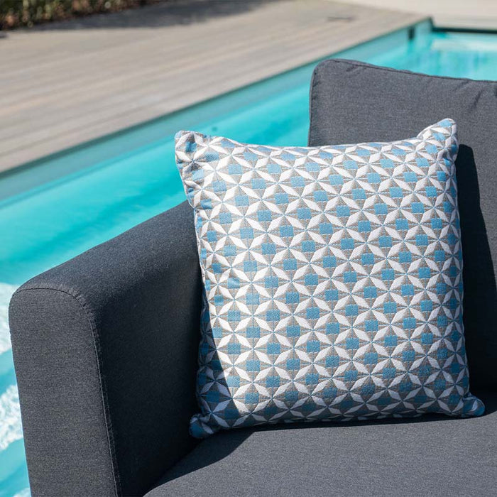 Elegant detail shot of a decorative pillow on the Pulse Left-Handed Dining Set, adding a touch of style and comfort to the sophisticated outdoor furniture.