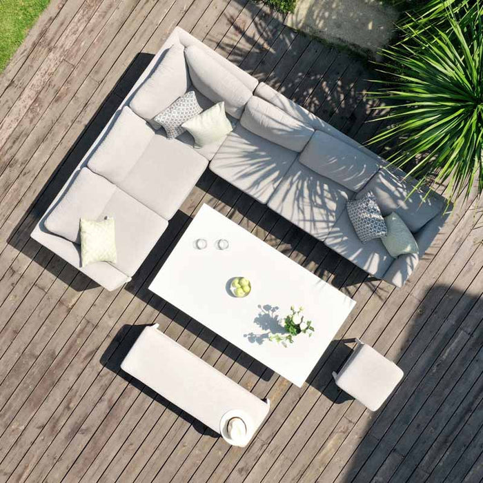 Top-down view of the Pulse Rectangular Corner Dining Set with Rising Table in an outdoor setting, showcasing the spacious seating and sleek design, perfect for outdoor lounging and dining.