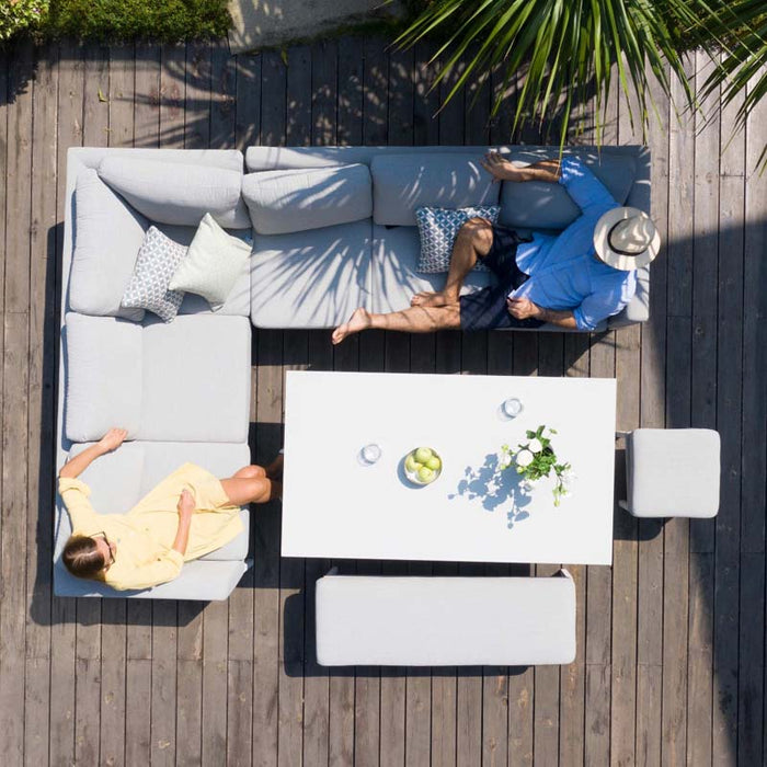 Bird's eye view of Pulse Rectangular Corner Dining Set with Rising Table in Lead Chine on wooden deck.