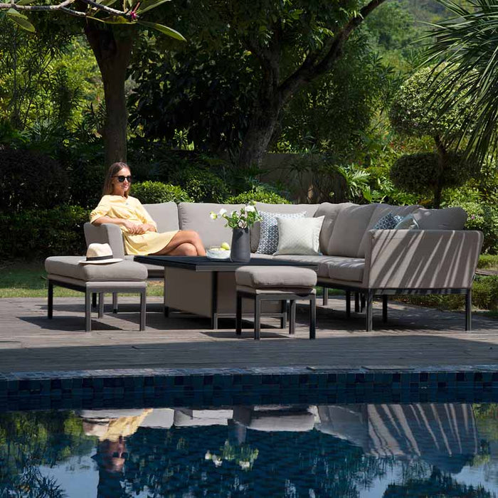 Poolside setting with the Maze Pulse Rectangular Corner Dining Set with Rising Table in taupe.