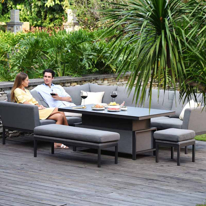 Relaxing couple seated on the Pulse Rectangular Corner Dining Set with Rising Table.