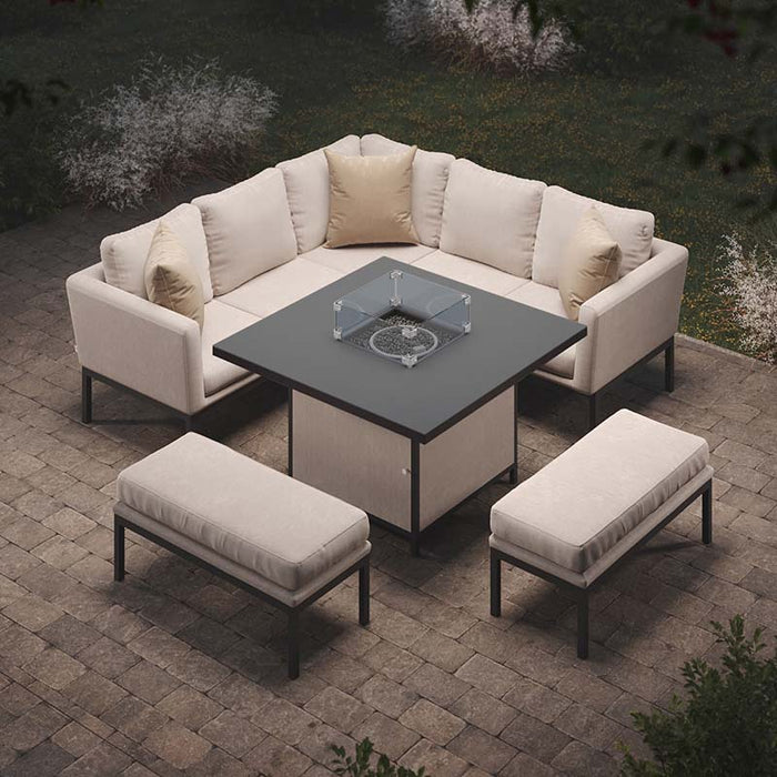 Elegant Pulse Square Corner Dining Set, featuring plush oatmeal cushions and a glowing fire pit table, creating a cosy ambiance for outdoor evening gatherings.