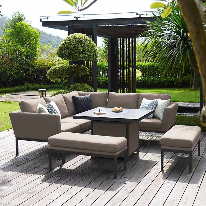 Maze Pulse Square Corner Dining Set with Fire Pit in taupe, set in a beautifully landscaped garden, providing a comfortable and stylish outdoor dining and lounging experience.