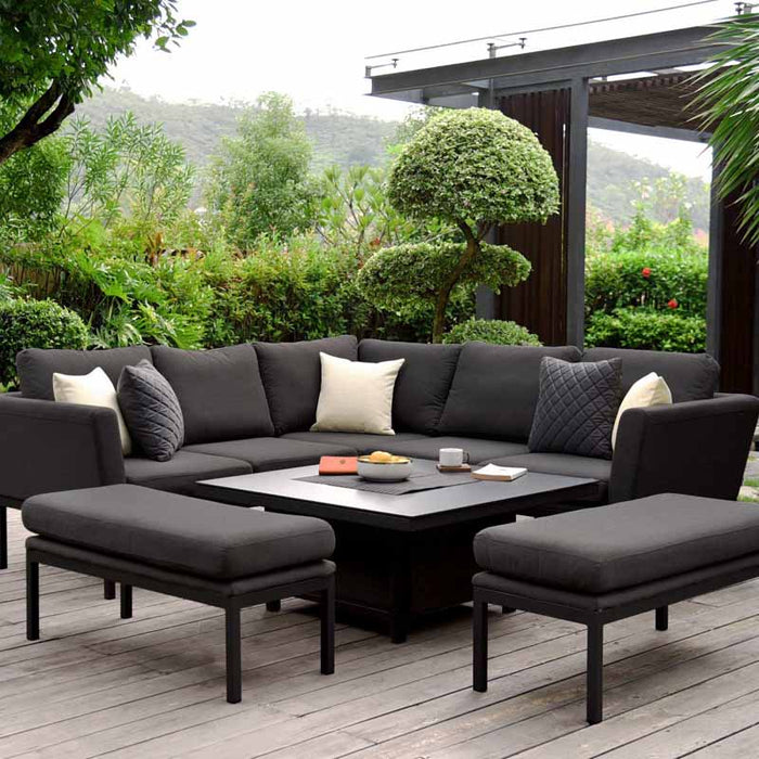 Close-up shot of the Pulse Square Corner Dining Set with Rising Table, showing the table and seating in charcoal.