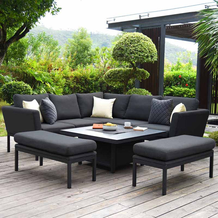 Full view of the Pulse Square Corner Dining Set with Rising Table in charcoal, displayed outdoors with cushions and accessories.