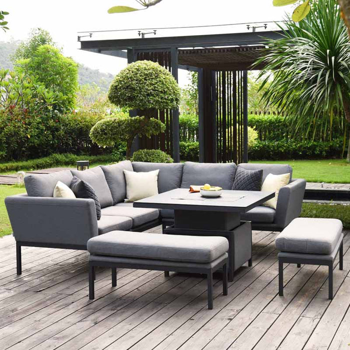 Pulse Square Corner Dining Set with Rising Table in flanelle, featuring a 3-seater sofa and bench in an outdoor garden setting.