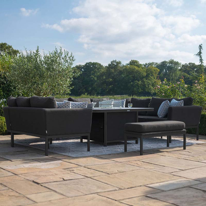 A stylish low-angle view of the Pulse U Shape Corner Dining Set in charcoal, featuring a sleek fire pit in the centre, perfect for outdoor relaxation and dining.