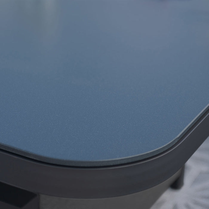 A close-up of the sleek table edge of the Pulse U Shape Corner Dining Set, highlighting the smooth and modern finish of the charcoal set.