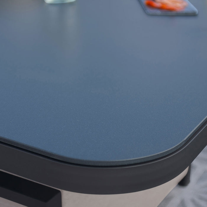 A close-up of the smooth table edge of the Pulse U Shape Corner Dining Set in taupe, highlighting its sleek and modern design.