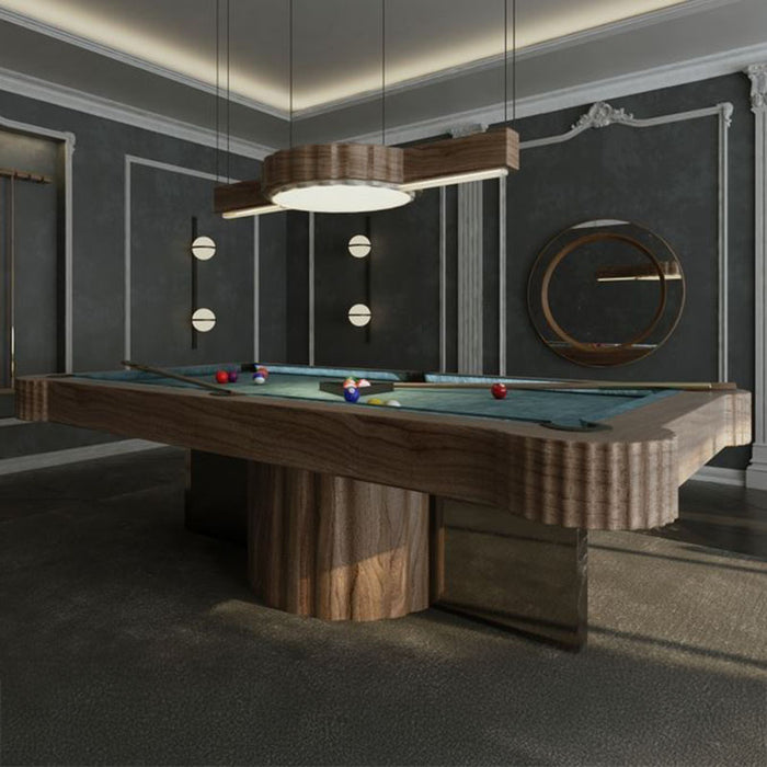 Stylish MBM Biliardi Amelia pool table with blue felt, placed in a high-end game room featuring architectural wall panelling and ambient lighting.