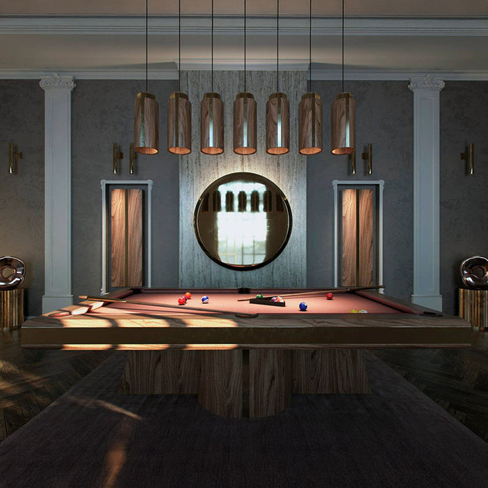 MBM Biliardi Amelia pool table with red felt in a premium home setting, surrounded by bespoke lighting and contemporary interior accents.