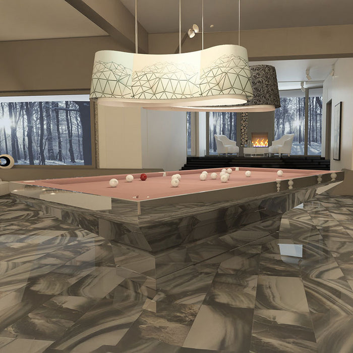 MBM Biliardi B_ig Pool Table with striking mirrored chrome base and muted pink felt, blending reflective luxury with modern art décor aesthetics.