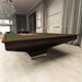 MBM Biliardi B_ig Pool Table in elegant green cloth with poker chips, blending billiards and gaming luxury in a high-end room.
