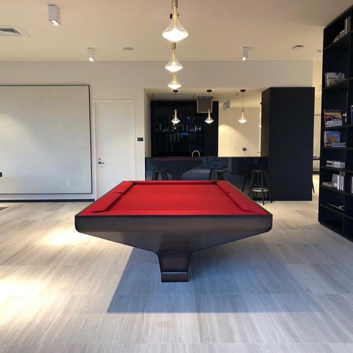 Contemporary MBM Biliardi B_ig Pool Table with dark wood frame and striking red felt, situated under pendant lighting in a modern residential games room.