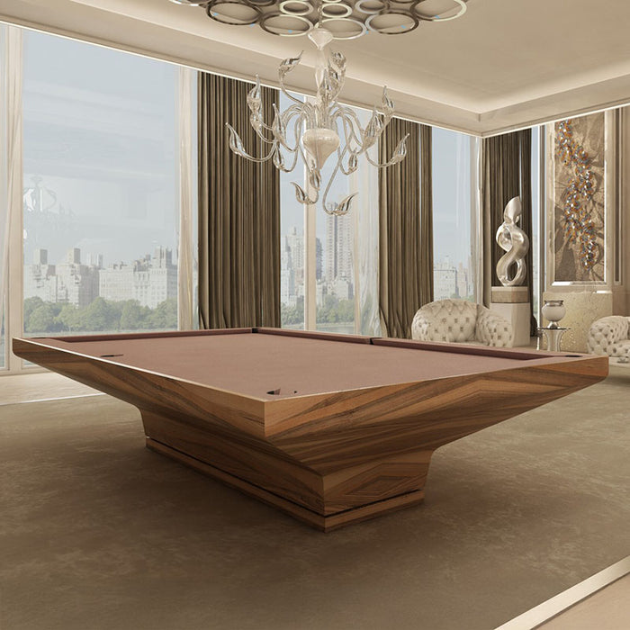 MBM Biliardi B_ig Pool Table with luxurious grain-matched wood finish and brown felt, placed in a refined penthouse with statement chandelier.