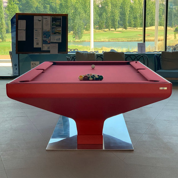 Modern MBM Biliardi B_ig Pool Table with red felt and sleek pedestal base, placed by full-length windows with scenic golf course views.