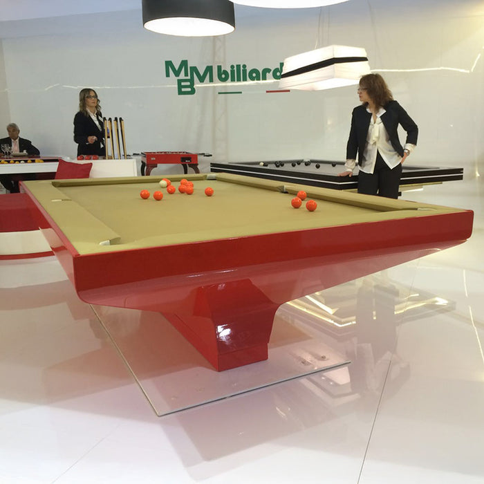 Contemporary red MBM Biliardi B_ig Pool Table with sand-coloured felt, displayed in a sleek exhibition space with guests.