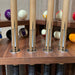 Close-up of MBM Biliardi Kyoto designer pool cue handles with intricate black patterns.