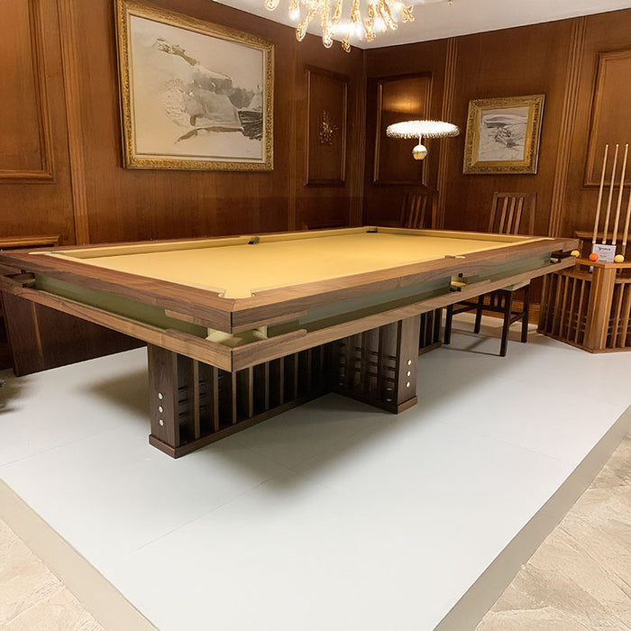 MBM Biliardi Kyoto luxury billiard table with yellow cloth in elegant wood-panelled room.