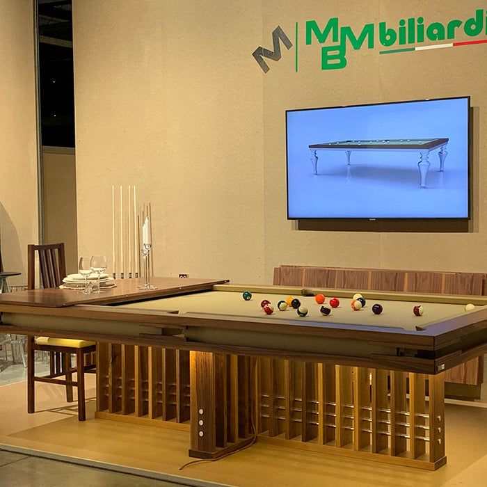 Side view of MBM Biliardi Kyoto luxury pool table set for dining at premium design fair.