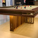 MBM Biliardi Kyoto luxury walnut pool table with balls in play and illuminated wooden base.