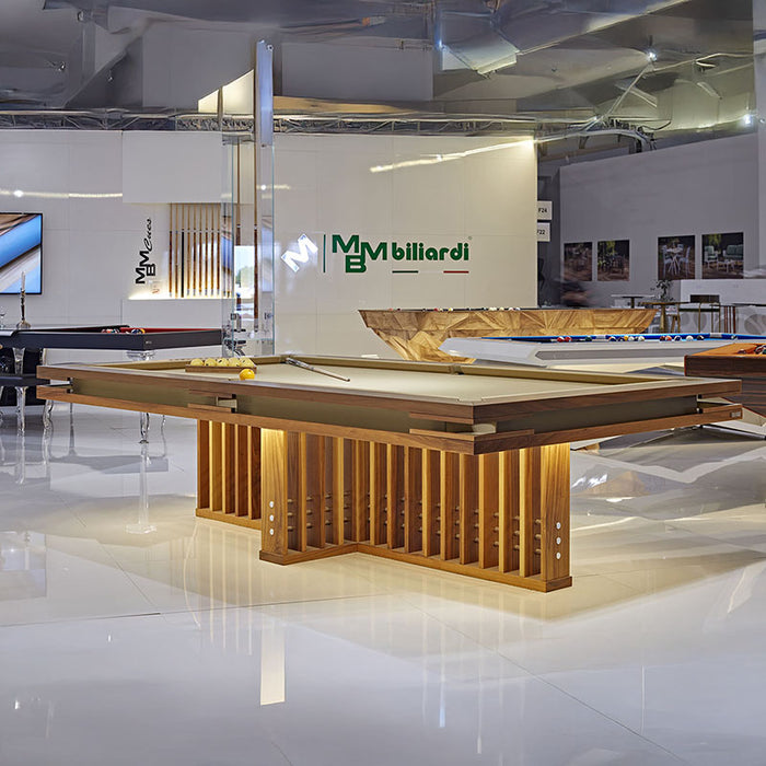 MBM Biliardi Kyoto luxury walnut pool table with illuminated base at premium design exhibition.