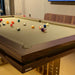 MBM Biliardi Kyoto premium billiard table with balls in play on beige cloth surface.