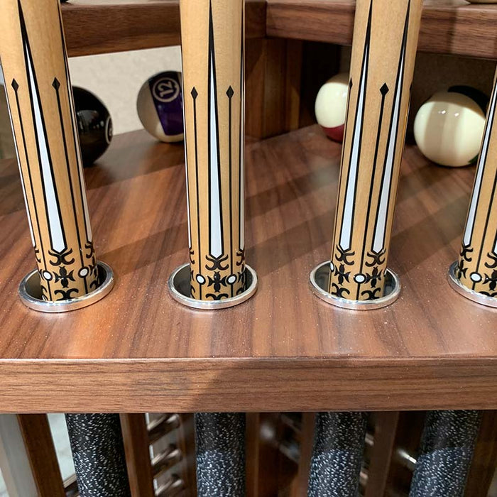 Close-up of MBM Biliardi Kyoto premium pool cues in wooden rack with decorative detailing.