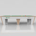 Front view of MBM Biliardi Quantum pool table with white and beechwood frame, green felt, and brand detailing for a contemporary Italian aesthetic.