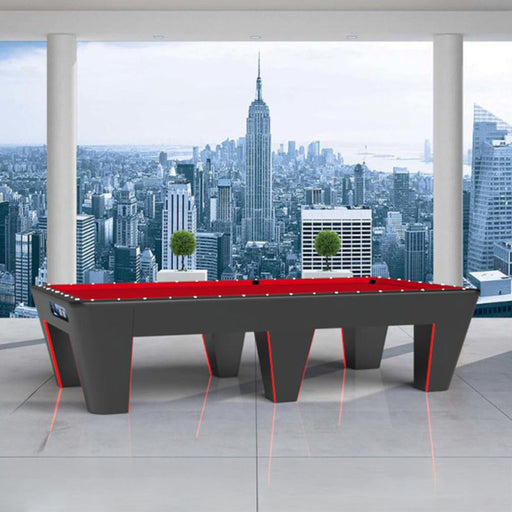 MBM Biliardi Quantum pool table with red felt and black body, displayed in a luxury high-rise interior with skyline city views.