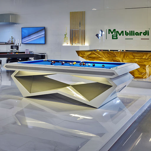 MBM Biliardi Stealth pool table in showroom, white frame with illuminated golden panels and blue felt, luxury contemporary billiard table.
