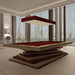 An elegant beige and red MBM Biliardi Ziggurat pool table in a luxurious apartment with floor-to-ceiling windows overlooking a cityscape.