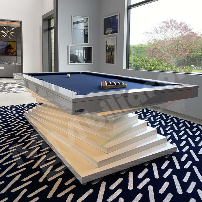 A luxurious MBM Biliardi Ziggurat pool table with red felt, white frame, and a blue accent on the layered base, in an elegant home interior.