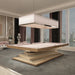 An elegant MBM Biliardi Ziggurat pool table with a light wood frame and soft pink felt, featured in a luxurious apartment with floor-to-ceiling windows and a modern chandelier.