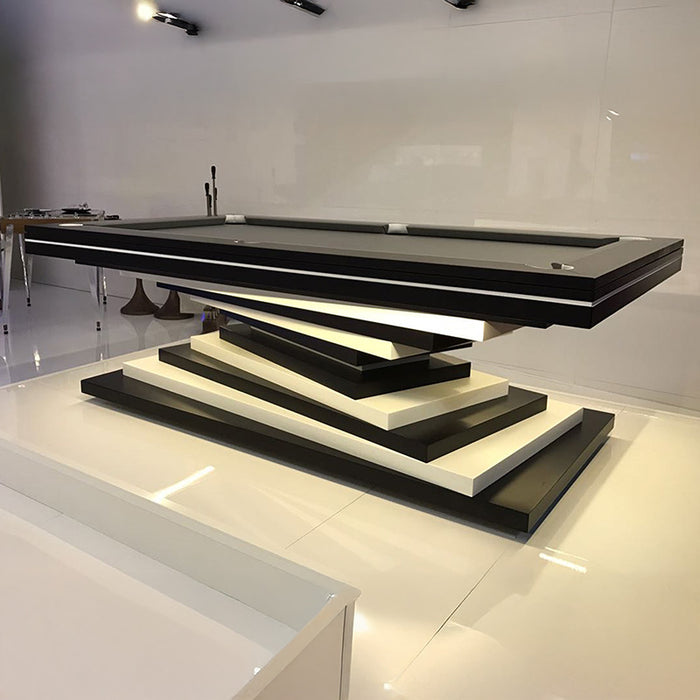 A sleek MBM Biliardi Ziggurat pool table in black and white, featuring a spiraling base design and a black felt surface.