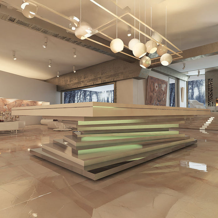 A contemporary MBM Biliardi Ziggurat pool table with a beige finish, featuring a stacked, spiraling base, in a luxury lounge setting.