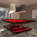 A striking red and black MBM Biliardi Ziggurat pool table in a contemporary luxury home setting, featuring unique pendant lamps and abstract art.