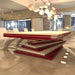 A versatile MBM Biliardi Ziggurat pool table in red and white, shown with modern white chairs, functioning as a dining table in a luxury home.